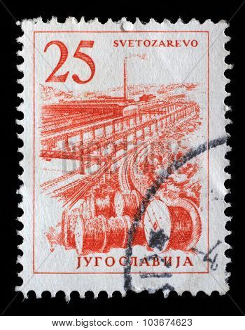 YUGOSLAVIA - CIRCA 1958: Stamp printed in Yugoslavia shows a Cable industry, Svetozarevo, with the same inscription, from series Industrial Progress, circa 1958