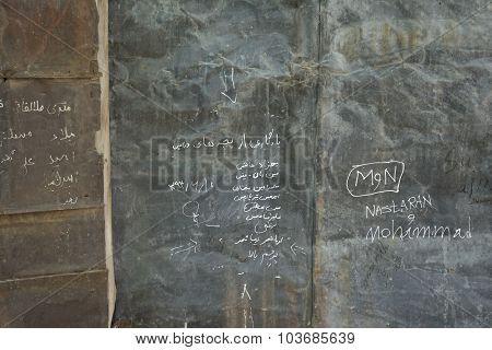 Old Brown Grunge And Rusty Metal Wall With Momentos  And Signs  Background