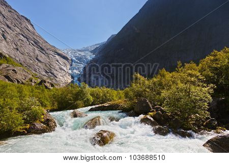 Waterfall near Briksdal glacier - Norway - nature and travel background