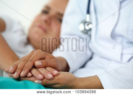 Friendly Female Doctor Hands Holding Patient Hand