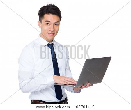 Businessman use of the notebook computre