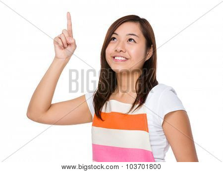 Asian young housewife tocuh on imaginary panel