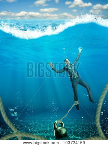 Woman with dumb-bell sinking