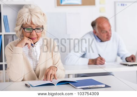 Elderly Students Working In Class