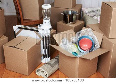 Moving boxes in new apartment. Real estate concept.