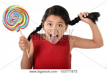 Happy Female Child Holding Big Lollipop Candy Pulling Pony Tail With Crazy Funny Face Expression