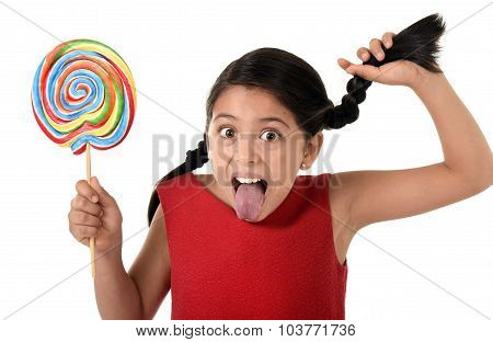 Happy Female Child Holding Big Lollipop Candy Pulling Pony Tail With Crazy Funny Face Expression In