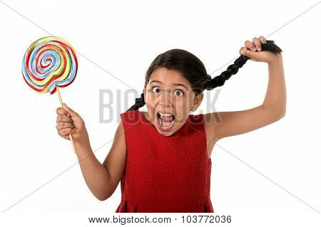 Happy Female Child Holding Big Lollipop Candy Pulling Pony Tail With Crazy Funny Face Expression In