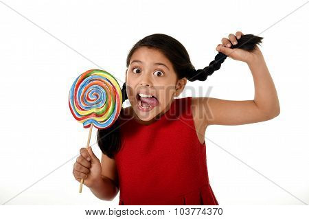 Happy Female Child Holding Big Lollipop Candy Pulling Pony Tail With Crazy Funny Face Expression In