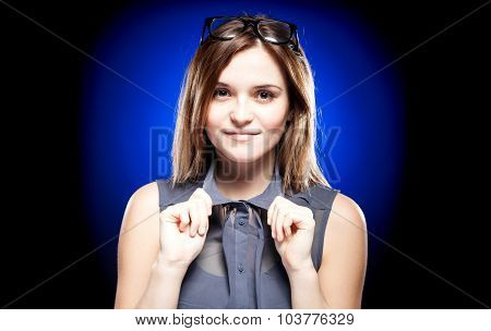 Young Woman With Nerd Glasses On Head Holding The Collar