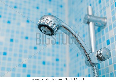 Head shower on blue background