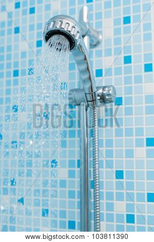 Head shower on blue background
