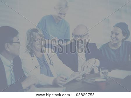 Group Of General Practitioners Having A Meeting Concept