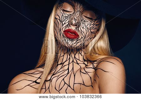 fashion portrait of girl with faceart