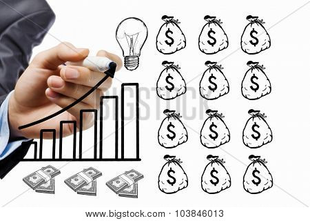 Close up of businessman drawing money making formula