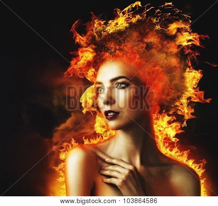 Firestarter. Abstract beauty portrait with burning flame as part of human