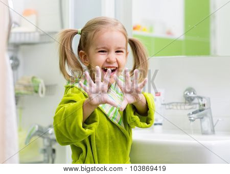 child washing hands