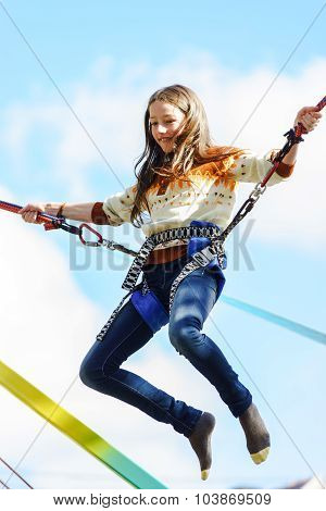 Teenage Girl Jumping With Bungie