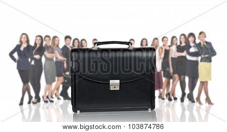 Black briefcase foreground and business peole