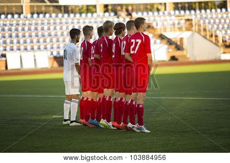 Row Of Football Players Wait Kick