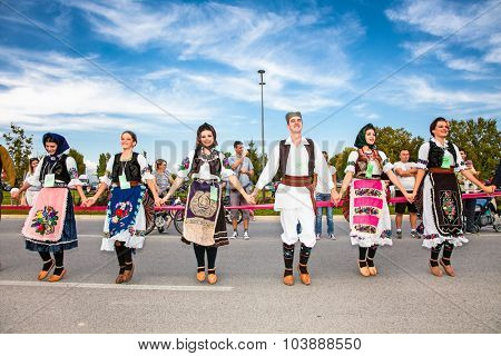 NOVI SAD, SERBIA-OCT 4, 2015: Guinness World Record Largest Folk Dance on Oct 4. 2015 in Novi Sad, Serbia. Over 12.000 participants break the Guinness World Record by simultaneously dancing a Kolo