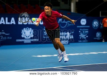 KUALA LUMPUR, MALAYSIA - SEPTEMBER 27, 2015: Takao Suzuki of Japan plays a return in his qualifying match at the Malaysian Open 2015 Tennis tournament held at the Putra Stadium, Malaysia.