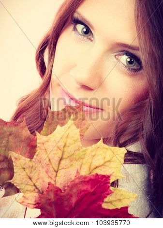 Pretty Autumnal Girl With Maple Leaves In Hand