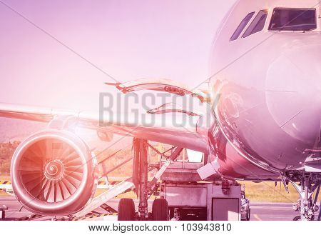 Detail Of Airplane At Terminal Gate Before Takeoff - Travel Concept And Wander Around The World