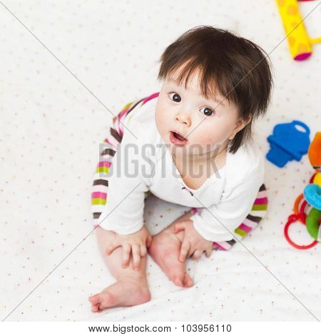 Baby Sitting In Playpen And Looking Up