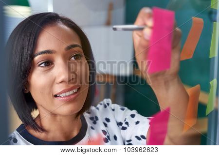 mixed race business woman brainstorming in modern office boardroom meeting