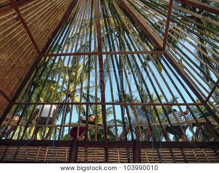 Worker Build A Bamboo Roof In Bali In Traditional Way