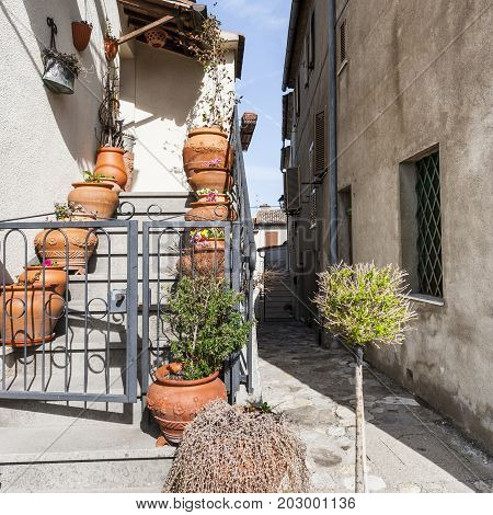 Village Trevinano located upon a hill near the borders of Lazio with the Tuscany and Umbria. Street in a old city without people and cars in Italy. Narrow street in the medieval italian town.