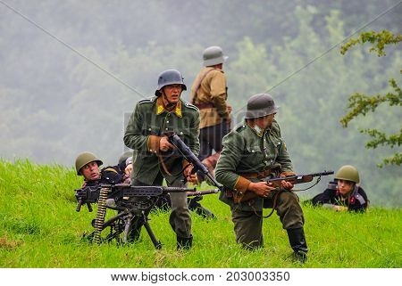 Soldiers with machine guns.The VIII International Festival of Military History and remake for the battle `1944` 6.08.2016 in Valga, Estonia