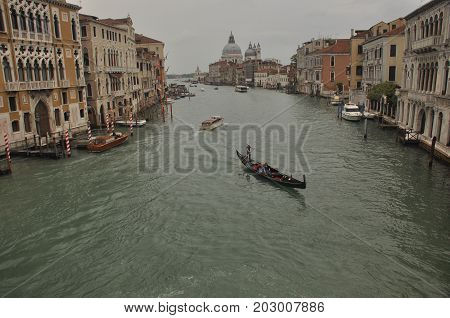 Narrow canals and alleyways in Venice. City of monuments in gondola.