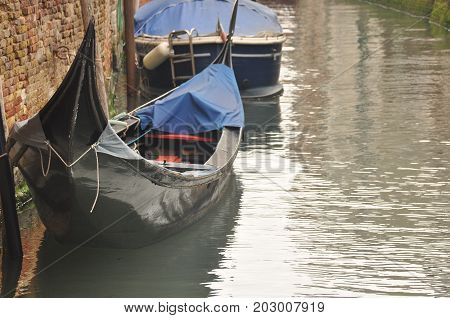 Narrow canals and alleyways in Venice. City of monuments in gondola.