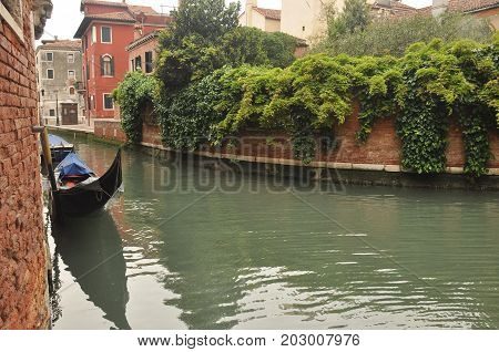 Narrow canals and alleyways in Venice. City of monuments in gondola.