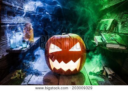 Glowing Pumpkin For Halloween In Witcher Hut With Color Smoke