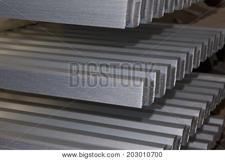 Profiled galvanized sheet in packs at the metal products warehouse Russia