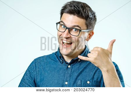 Call Me! Handsome Young Man Showing Call Me Sign