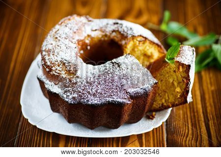 Sweet big honey cake on a white plate