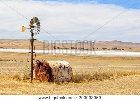 G'day on a water tank next to a wind wheel - SA Australia