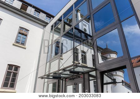 AURICH, GERMANY - JULY 18, 2017: Reflecting windows of the Landgericht building in Aurich, Germany