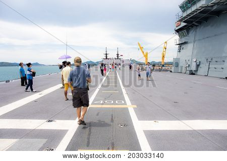Rayong, Thailand, 13 August 2017: People or traveler visit the battle ship name Chakri Naruebet or Chakrinaruebet at the Royal Thai Navy of Rayong, Thailand.