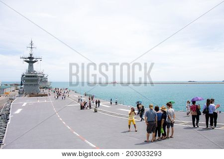 Rayong, Thailand, 13 August 2017: People or traveler visit the battle ship name Chakri Naruebet or Chakrinaruebet at the Royal Thai Navy of Rayong, Thailand.