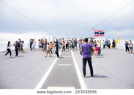 Rayong, Thailand, 13 August 2017: People or traveler visit the battle ship name Chakri Naruebet or Chakrinaruebet at the Royal Thai Navy of Rayong, Thailand.