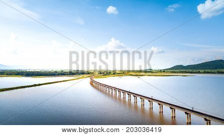 Aerial Photo Railway Curve Track to the mountains is located on the River Pasak River DamLopburi Thailand