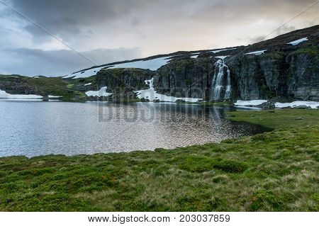 Waterfall in the mountains along the National tourist route Aurlandstjellet. Flotane. Western Norway