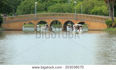 Chatuchak, Bangkok, Thailand. - August 30, 2015 : People are relaxing with duck boat at Chatuchak park in Thailand.Good garden for relax and activity in the nature.