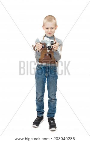 Boy with camera on white background isolated studio
