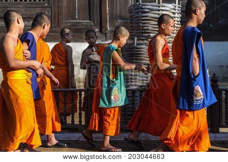 CHIANG MAI THAILAND - 1/29/2016: Novice monks at Wat Prasat temple in Chiang Mai Thailand.